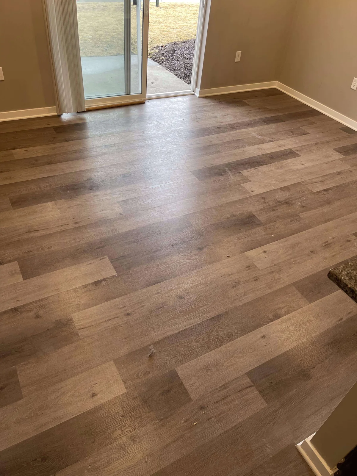 Detail of warm wood-tone flooring from Superior Flooring's project gallery